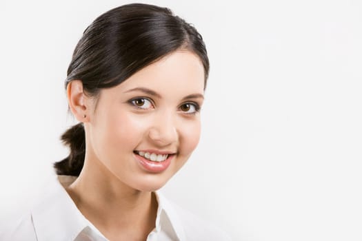 Face of pretty girl looking at camera over white background