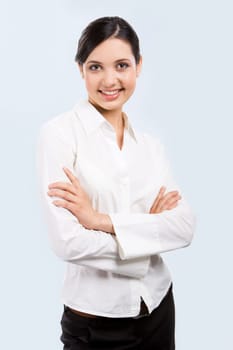Portrait of elegant businesswoman with her arms crossed on  white background