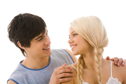 Image of beautiful blonde looking at handsome man while he embracing her