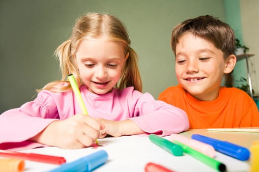 Image of classmates sitting next to each other during drawing lesson