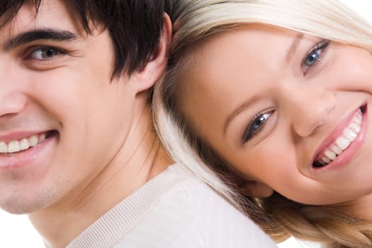 Close-up of happy couple looking at camera with smiles