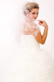 Portrait of pretty bride posing in isolation