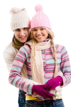 Portrait of happy young couple in warm clothes over white background
