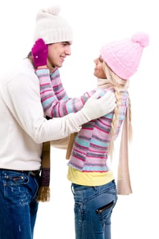 Portrait of happy young couple in warm clothes looking at each other