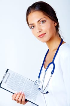 Portrait of pretty assistant with clipboard in hand looking at camera over white background