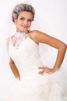Portrait of beautiful smiling bride posing in isolation