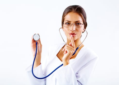Portrait of happy clinician with stethoscope looking at camera