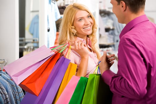 Portrait of happy woman communicating with her boyfriend near by