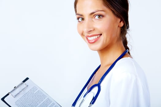 Portrait of pretty female assistant with clipboard looking at camera on white background