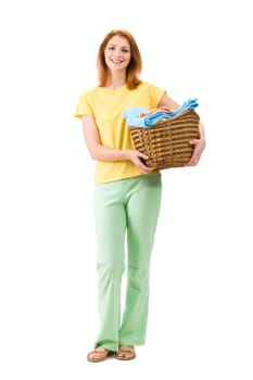 Portrait of young female with stack of colorful towels smiling to camera
