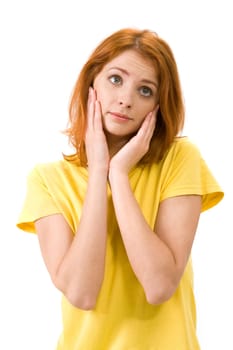 Portrait of young female touching her face in confusion