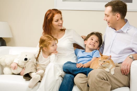 Curious children and woman listening attentively to man telling an interesting story