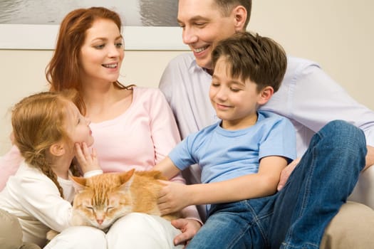 Portrait of affectionate parents and their children enjoying weekend day at home