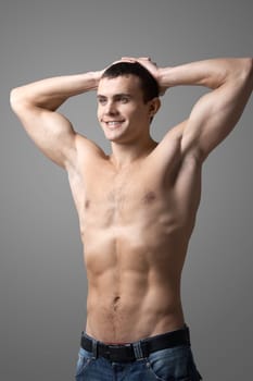 Image of handsome man with bare torso posing before camera