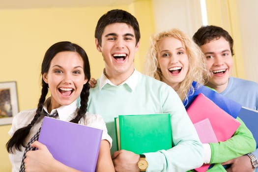 Portrait of happy students laughing next to each other