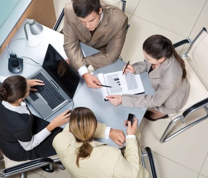 Above view of executive people interacting at corporate meeting