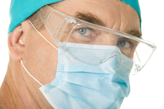 Close-up of surgeon wearing mask over white background