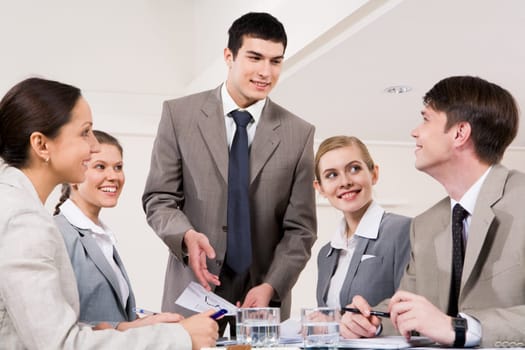 Successful business partners looking at each other during discussion of new plan