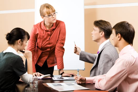 Teacher listening explanation of confident businessman at seminar