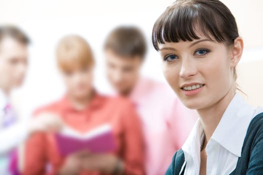 Face of young employee looking at camera with smile