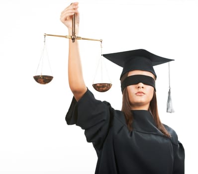 Young lawyer with closed eyes holding scales