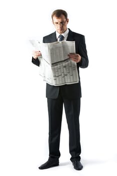 Vertical image of successful boss reading newspaper in studio