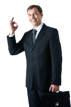 Vertical image of successful businessman looking at camera with smile