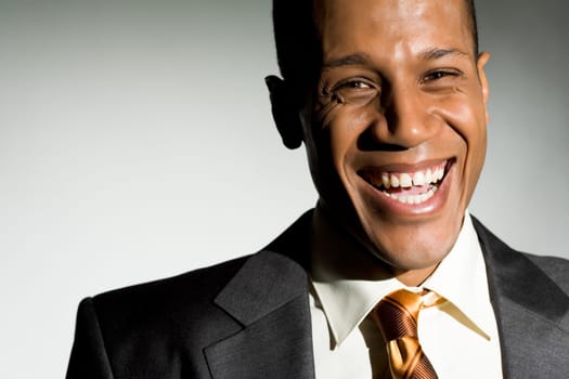 Portrait of attractive man looking at camera and laughing