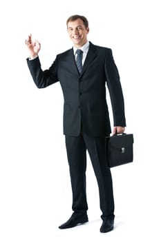 Vertical image of successful boss standing in studio