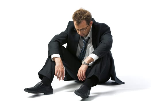 Portrait of stressed businessman left to the mercy of fate