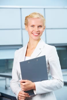 Portrait of elegant businesswoman smiling while looking at camera