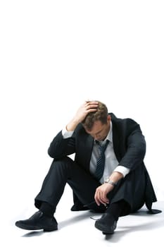 Portrait of stressed businessman touching his head and thinking about future