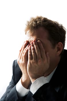 Photo of stressed businessman hiding his face with hands