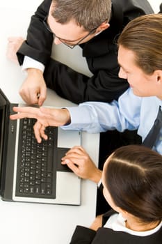 Above view of business people working with laptop