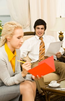 Photo of working business partners in modern office