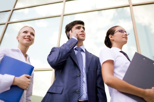 Portrait of confident business group looking aside and upwards