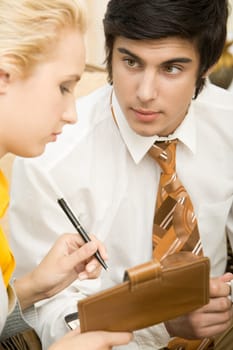 Portrait of confident businessman looking at his partner during explanation
