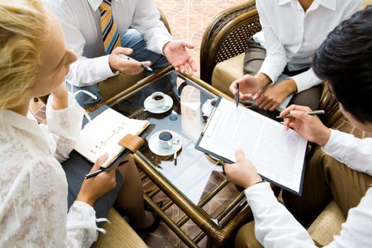 Close-up of businesspeople discussing a plan at meeting