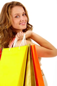 Portrait of a girl with paper bags looking at camera and smiling