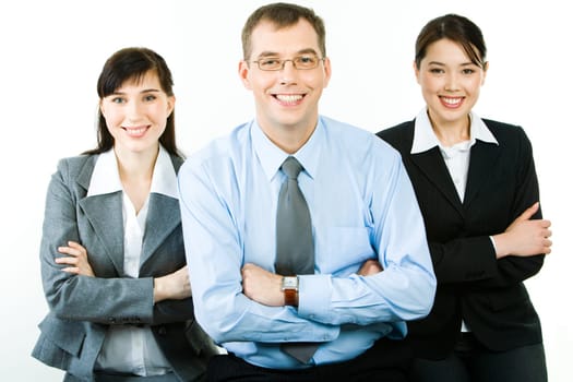 Portrait of successful business partners folding their arms and looking at camera with happy smiles