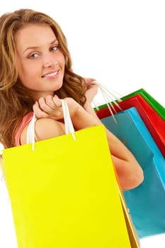 Portrait of a girl with handbags looking at camera and smiling