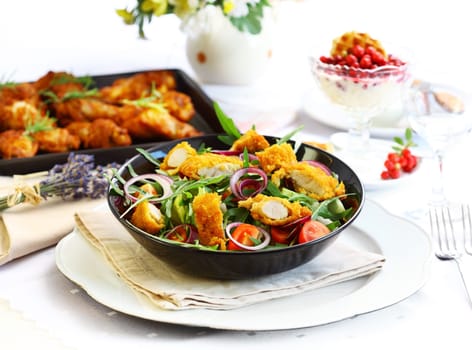 Summer lunch - vegetable salad with chicken wings and yogurt dessert