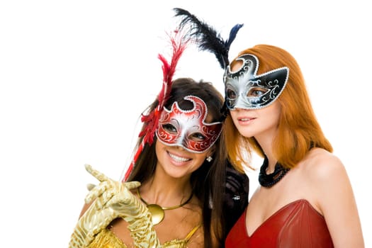 Portrait of glamorous girls looking through venetian masks during carnival