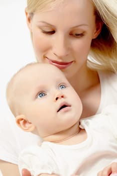 Portrait of happy woman holding her small daughter