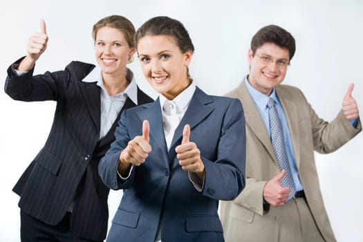 Portrait of successful business team showing sign of okay