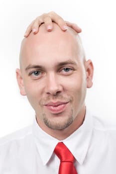 Portrait of smiling man with feminine hand on his bald head