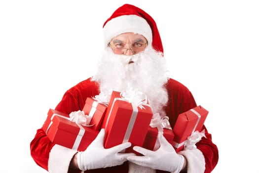 Photo of happy Santa Claus with red giftboxes looking at camera