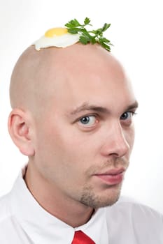 Portrait of strange man with fried egg on top of bald head