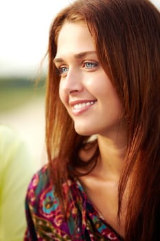 Portrait of happy girl in fashionable clothing looking aside