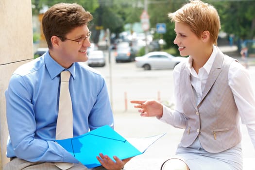 Image of two business partners interacting and planning work